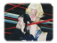 Rough action from the 2002 G.L.O.R.Y. Convention: Lady Vendetta chokes Ariel over the lower rope.