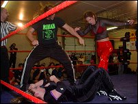 IWF top male wrestler Roman jumps in the ring and helps Allison work over Alicia.