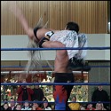 This time Angel gets caught off guard, and she's going to pay the price as she is about to get hit with a power bomb.