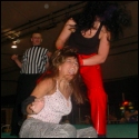 Allison Danger looks like she's had just about enough of trying to wrestle Ariel on the up-and-up. If she can't win fair and square, Allison is just as happy to get a victory without the rulebook. This hairpull, for instance, on a screaming Ariel...