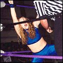 The referee raises the arm of an exhausted Macaela Mercedes.