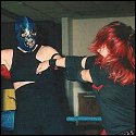 Sonya Blackhawk pulls the masked wrestler out of the corner.