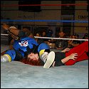 Sonya Blackhawk gets crushed with a leg drop delivered by a huge male opponent who interfered in one of her recent matches.