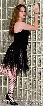 Sexy Liz Savage is working her way up the managerial ranks while she trains to participate more actively in the ring.