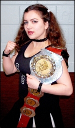 December poses with her title belt.