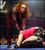 DellaMorte uses the hair to drag an opponent up for more punishment.