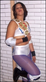 Dymond relaxes with one of her title belts.