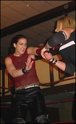 Melissa feels the pain as Alicia wrings the arm.