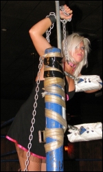 A study in contrasts: beautiful Hailey enters the ring with a deadly steel chain.