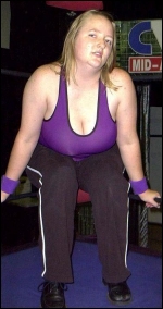 Referees still have to train in the ring! Katie relaxes on the middle turnbuckle during a break in a recent training session. Referees still have to train in the ring! Katie relaxes on the middle turnbuckle during a break in a recent training session.