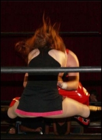 Megan hits her finisher, <span style="font-style:italic">"The Toxic Kiss"</span>.