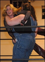 Miss Dixie is about to take a slam from one of the Moonshiners.