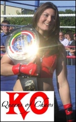Nikita proudly carries her "Queen Of Chaos" title belt.