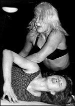 Ms. Banner works over the arm of a suffering opponent. Ms. Banner works over the arm of a suffering opponent.