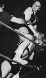 Penny took her share of bumps. Here June Byers introduces the back of Penny's head to the turnbuckle. Penny took her share of bumps. Here June Byers introduces the back of Penny's head to the turnbuckle.