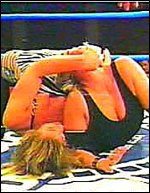 Sue could take as much as she would dish out. Here, Ms. Sexton is being stretched hard by Madusa Micelli...but she refuses to submit. Sue could take as much as she would dish out. Here, Ms. Sexton is being stretched hard by Madusa Micelli...but she refuses to submit.