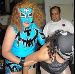 Tsunami brawls with an opponent outside the ring.