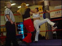 Ariel recoils in the corner after a brutal...and we do mean BRUTAL...chop from Phoenix.