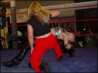 Ariel's in trouble as she absorbs a bone-shattering backbreaker courtesy of Phoenix.