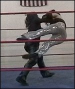 Hades shows Ariel no mercy as he tosses his own sister across the ring by her long, beautiful hair.