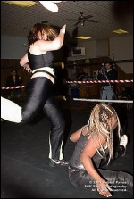 The Chachster sends a vicious kick to the back of Luscious Latasha.