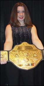 Dixie displays her BANG! Women's Title belt. She's the youngest woman to ever hold the title.