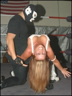 Fantasy takes punishment in a mixed match against a much bigger male opponent!