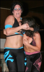 Rogers clamps a tight headlock on Serena Deeb.