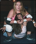 Missy Sampson seems to enjoy torturing Ariel with this nasty looking camel clutch.