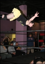 DeVille goes high risk with her patented swanton off the top rope.