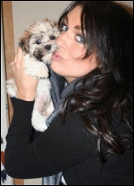 Rain gets a kiss from one of her biggest fans...her pet Bailey.