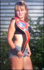 Sara poses with one of her championship belts.