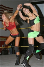 Stephie violently works over her opponent's arm.