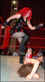 Skarlett puts the boots to her opponent.