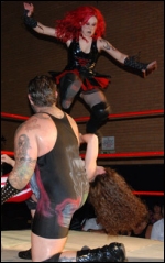 Skarlett launches from the top rope.